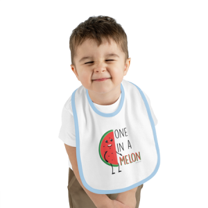 small boy in fruit bib